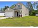 Attractive home with a tidy front yard, including manicured flower beds and a tidy front lawn at 120 Carolina Lakes Blvd., Myrtle Beach, SC 29588