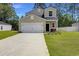 Well-maintained home with a two-car garage, a freshly sealed driveway, and a tidy landscaped yard at 120 Carolina Lakes Blvd., Myrtle Beach, SC 29588