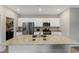 Bright kitchen with granite countertops and stainless steel appliances, featuring an adjacent laundry room at 120 Carolina Lakes Blvd., Myrtle Beach, SC 29588