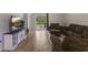 Comfortable living room with sliding glass door leading to the backyard and a wall mounted TV at 120 Carolina Lakes Blvd., Myrtle Beach, SC 29588