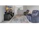 Upstairs living room featuring hardwood floors, comfortable seating, and a wall-mounted TV at 120 Carolina Lakes Blvd., Myrtle Beach, SC 29588