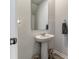 Compact powder room featuring a pedestal sink, a framed mirror, and neutral paint at 120 Carolina Lakes Blvd., Myrtle Beach, SC 29588