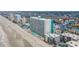 Aerial shot showing building's beach front access and proximity to other homes and businesses at 1210 N Waccamaw Dr. # 1105, Murrells Inlet, SC 29576