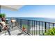 Relaxing oceanfront balcony with comfortable seating and stunning water views at 1210 N Waccamaw Dr. # 1105, Murrells Inlet, SC 29576