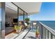 Inviting balcony with seating area and stunning ocean views, perfect for relaxing and enjoying the scenery at 1210 N Waccamaw Dr. # 1105, Murrells Inlet, SC 29576
