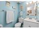 Cozy bathroom with beach decor, complemented by a white vanity and modern fixtures at 1210 N Waccamaw Dr. # 1105, Murrells Inlet, SC 29576