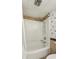 Bathroom featuring a tub with shower, with a white shower surround and updated shower head at 1210 N Waccamaw Dr. # 1105, Murrells Inlet, SC 29576