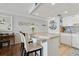 Bright dining area with a modern island, pendant lighting, and easy access to the kitchen appliances at 1210 N Waccamaw Dr. # 1105, Murrells Inlet, SC 29576
