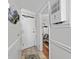Inviting entryway with neutral tones and a glimpse into the well-lit living space at 1210 N Waccamaw Dr. # 1105, Murrells Inlet, SC 29576