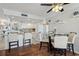 Inviting kitchen with white appliances, wooden floors, and a cozy breakfast nook at 1210 N Waccamaw Dr. # 1105, Murrells Inlet, SC 29576