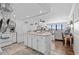 Open-concept kitchen with an island, connecting to the living and dining areas with ocean views at 1210 N Waccamaw Dr. # 1105, Murrells Inlet, SC 29576