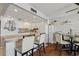 Bright, fully equipped kitchen with white cabinetry, stainless steel appliances and breakfast bar seating at 1210 N Waccamaw Dr. # 1105, Murrells Inlet, SC 29576