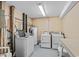 A communal laundry room with two washing machines and dryers at 1210 N Waccamaw Dr. # 1105, Murrells Inlet, SC 29576