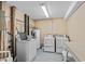 A communal laundry room with two washing machines and dryers at 1210 N Waccamaw Dr. # 1105, Murrells Inlet, SC 29576