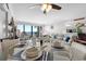 Living room with a dining table set, and balcony overlooking ocean views at 1210 N Waccamaw Dr. # 1105, Murrells Inlet, SC 29576