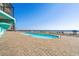 A view of an outdoor pool with an ocean view at 1210 N Waccamaw Dr. # 1105, Murrells Inlet, SC 29576