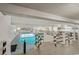 Indoor pool with bright natural light and seating at 1210 N Waccamaw Dr. # 1105, Murrells Inlet, SC 29576