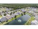 Aerial view of the community featuring pond with fountain and waterfront homes at 140 Avondale Dr., Myrtle Beach, SC 29588