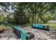Spacious backyard featuring a well-maintained patio with comfortable outdoor seating, perfect for entertaining at 140 Avondale Dr., Myrtle Beach, SC 29588