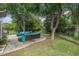 Spacious backyard featuring a well-maintained patio with comfortable seating and shade trees at 140 Avondale Dr., Myrtle Beach, SC 29588