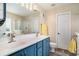 Bathroom featuring double sinks, blue vanity, and a glass-enclosed shower at 140 Avondale Dr., Myrtle Beach, SC 29588