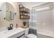 Renovated bathroom has modern black fixtures and stylish woven basket shelves at 140 Avondale Dr., Myrtle Beach, SC 29588
