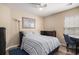 Cozy bedroom featuring a blue striped comforter, wood floors, and natural light at 140 Avondale Dr., Myrtle Beach, SC 29588