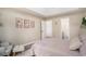 Comfortable bedroom boasts neutral tones, modern flooring, and an ensuite bathroom at 140 Avondale Dr., Myrtle Beach, SC 29588