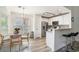 Modern kitchen featuring stainless steel appliances, breakfast bar seating, and an adjacent dining area at 140 Avondale Dr., Myrtle Beach, SC 29588