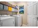 Laundry room with modern washer and dryer and shelving for storage at 140 Avondale Dr., Myrtle Beach, SC 29588