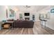 Bright living room featuring a fireplace, modern lighting, and a comfortable sectional sofa at 140 Avondale Dr., Myrtle Beach, SC 29588