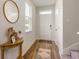 Inviting home entryway with hardwood floors, a stylish mirror, and plenty of natural light at 1403 Nokota Dr., Conway, SC 29526