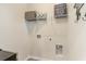 Functional laundry room with connections and shelving for organized storage at 1403 Nokota Dr., Conway, SC 29526