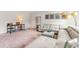 Bright living room features a modern sectional sofa, ottoman, workspace desk, and decorative wall art at 1403 Nokota Dr., Conway, SC 29526