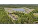 Aerial view of the neighborhood and a pond surrounded by houses at 1476 Burriss Rd., Conway, SC 29526