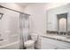 Bathroom with granite countertop, shower/tub combo, toilet, and fixtures at 1476 Burriss Rd., Conway, SC 29526
