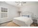 Bright bedroom featuring a comfy bed, hardwood floors, and coastal-inspired decor at 1476 Burriss Rd., Conway, SC 29526