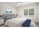 Cozy bedroom with hardwood floors, a comfortable bed, and a calming blue color scheme at 1476 Burriss Rd., Conway, SC 29526