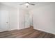 Bedroom with wood flooring, a ceiling fan, and two white doors at 1476 Burriss Rd., Conway, SC 29526