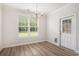 Dining room with hardwood floors and a window overlooking the backyard at 1476 Burriss Rd., Conway, SC 29526