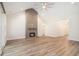Spacious living room with a brick fireplace, vaulted ceiling, and hardwood floors at 1476 Burriss Rd., Conway, SC 29526