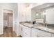 Main bathroom features double vanity with granite countertops, white cabinets, and glass shower at 1476 Burriss Rd., Conway, SC 29526
