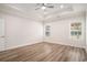 Spacious main bedroom features tray ceilings, hardwood floors, and large windows at 1476 Burriss Rd., Conway, SC 29526