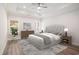 Serene primary bedroom with tray ceiling, natural light, and neutral décor with hardwood floors at 1476 Burriss Rd., Conway, SC 29526