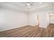 Bright main bedroom features hardwood floors, tray ceilings, and natural light at 1476 Burriss Rd., Conway, SC 29526
