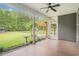 Screened patio with view of pergola, backyard, and landscaped garden at 1476 Burriss Rd., Conway, SC 29526