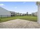 Spacious backyard with a concrete patio and black metal fence, perfect for outdoor activities at 148 Long Leaf Pine Dr., Conway, SC 29526