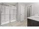 Bathroom with a large shower, neutral walls, light woodgrain floors, and vanity at 148 Long Leaf Pine Dr., Conway, SC 29526