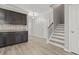 A view of the entryway featuring woodgrain flooring, stairs, and adjacent kitchen cabinets at 148 Long Leaf Pine Dr., Conway, SC 29526