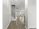 Inviting foyer with wood-look flooring, staircase with iron spindles, and an open view into the living spaces at 148 Long Leaf Pine Dr., Conway, SC 29526